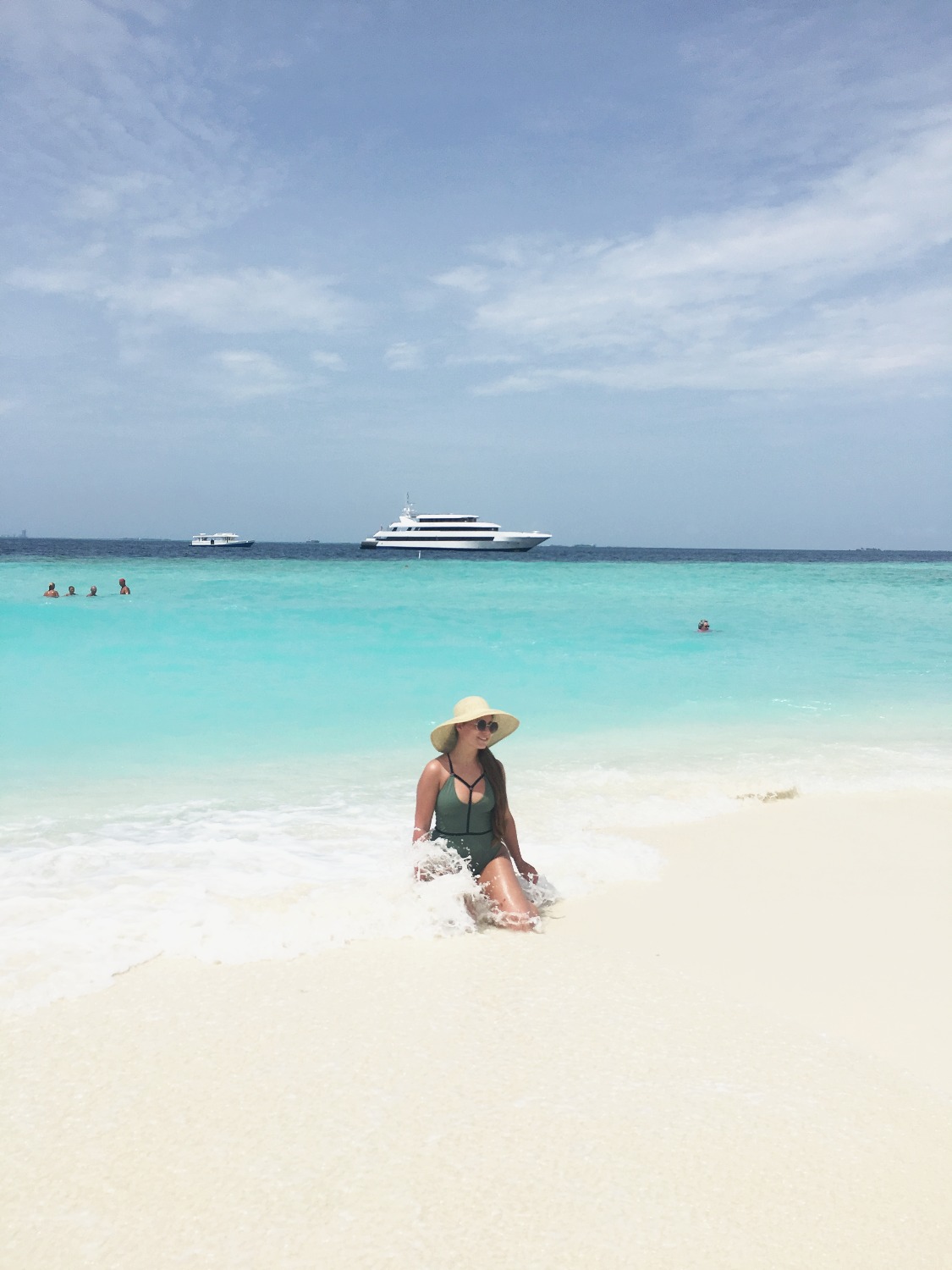 Private boat stopped at a sandbank in the Maldives