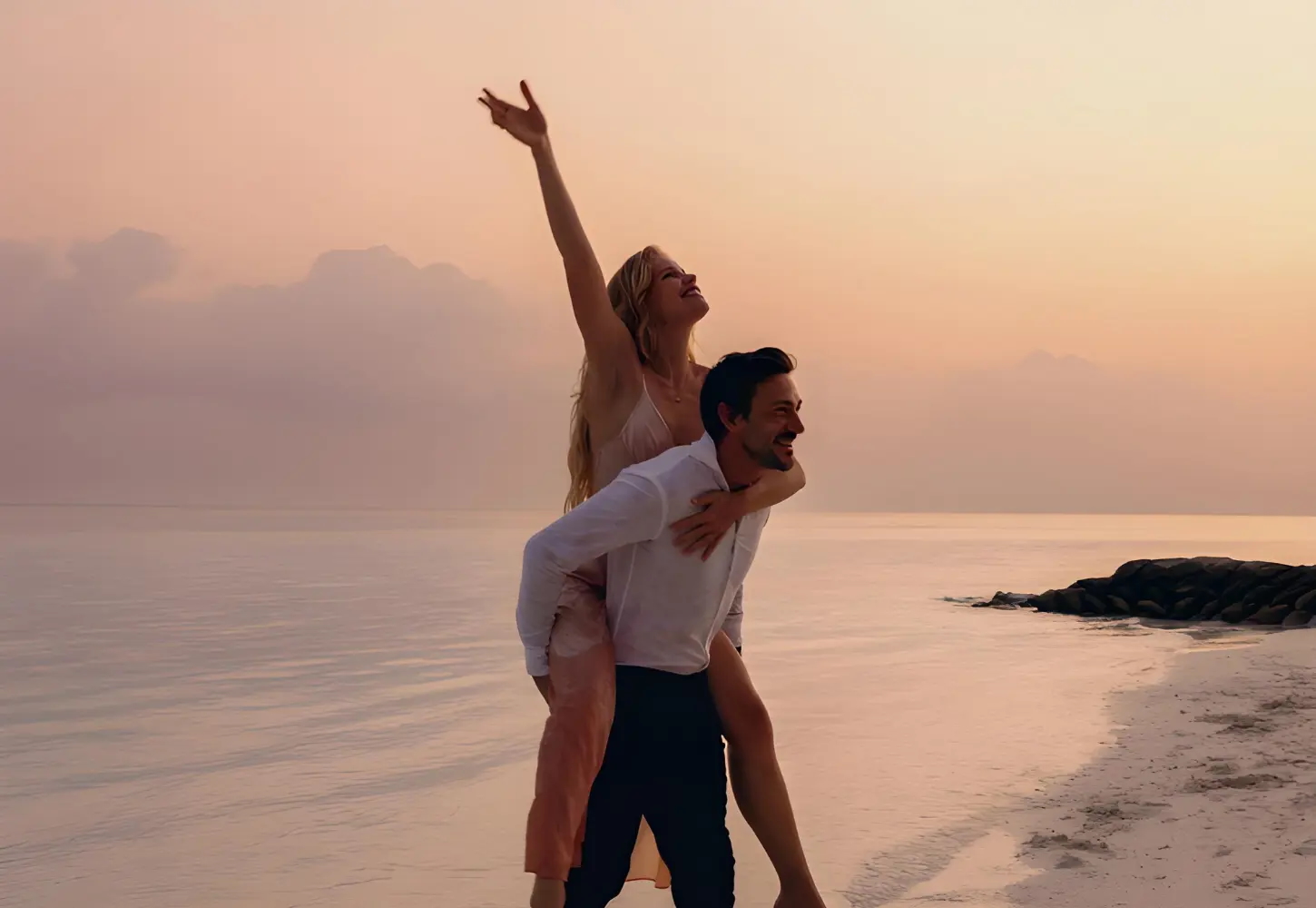 Honeymoon couple aboard a private yacht at sunset in the Maldives