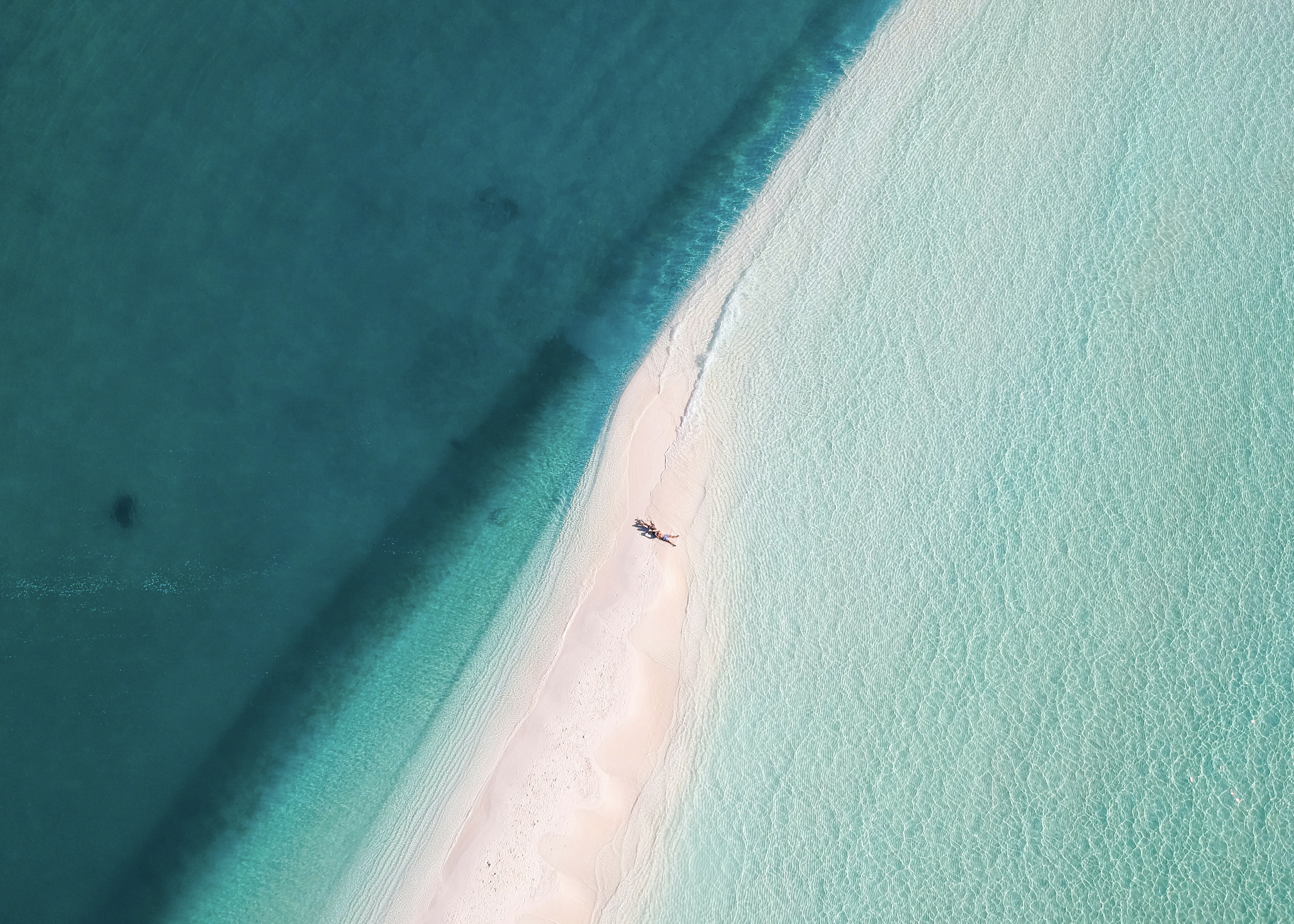 Guests on a private Maldives sandbank
