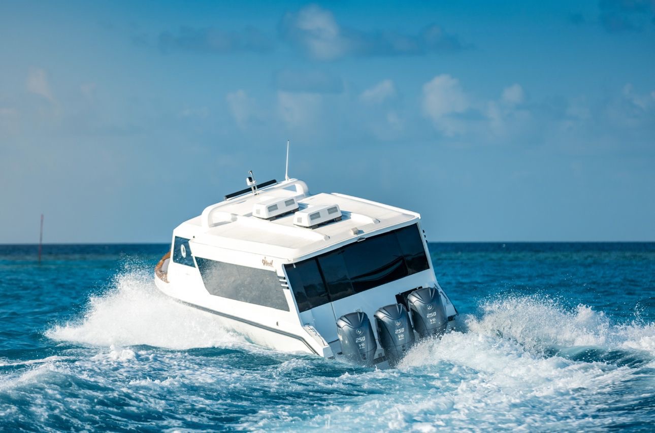 Private speedboat cutting across turquoise Maldives water on a day charter